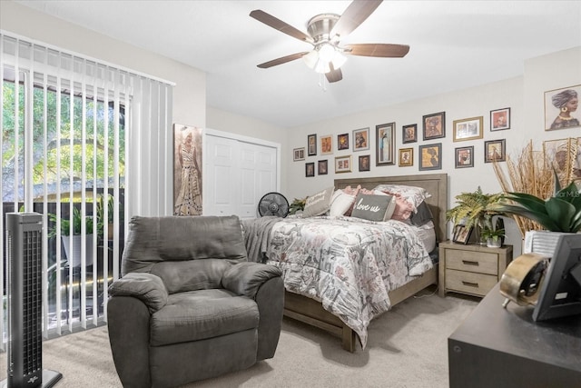 bedroom featuring access to outside, light colored carpet, and ceiling fan