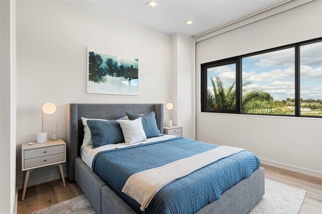 bedroom with light hardwood / wood-style flooring