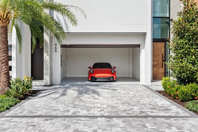 garage featuring a carport