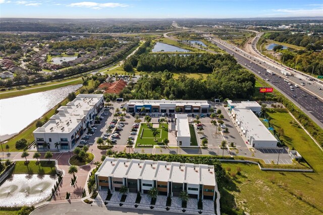 drone / aerial view with a water view