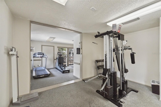 workout area with a textured ceiling