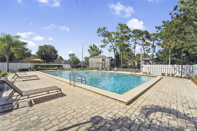 view of swimming pool featuring a patio area