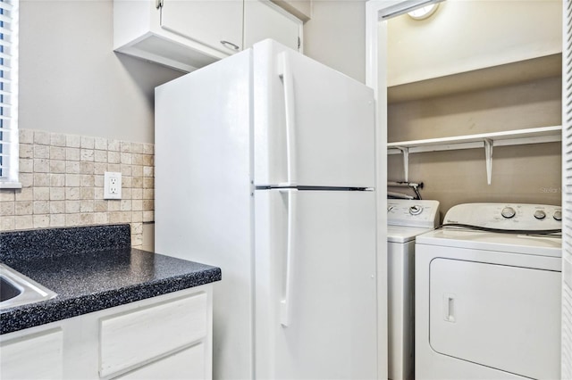 washroom featuring independent washer and dryer