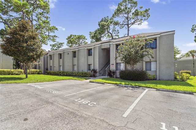 view of property with uncovered parking