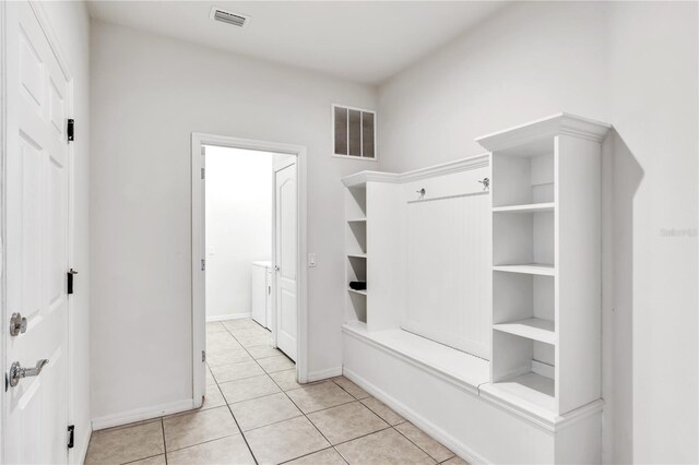 mudroom with light tile patterned floors