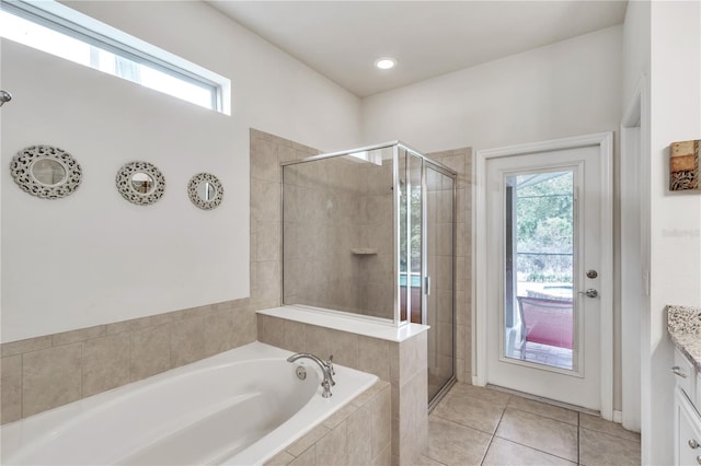 bathroom with vanity, independent shower and bath, and tile patterned floors