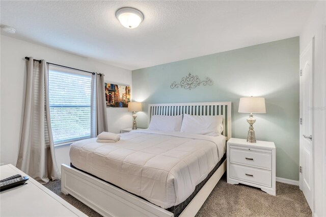 bedroom featuring light carpet