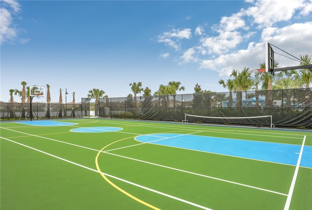 view of basketball court with community basketball court and fence