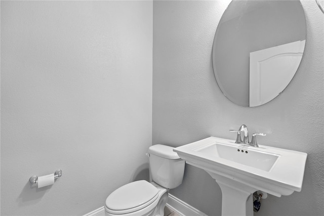 bathroom with toilet and sink