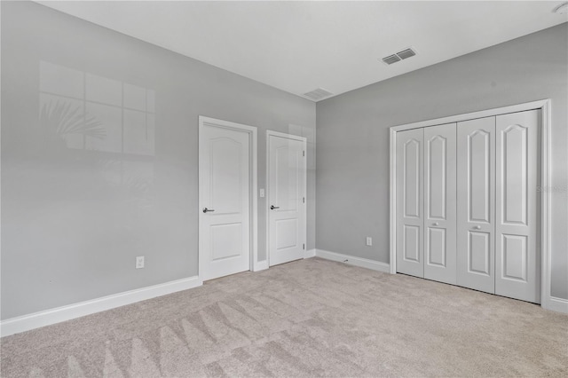 unfurnished bedroom with light carpet