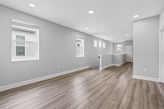 unfurnished room with light hardwood / wood-style floors