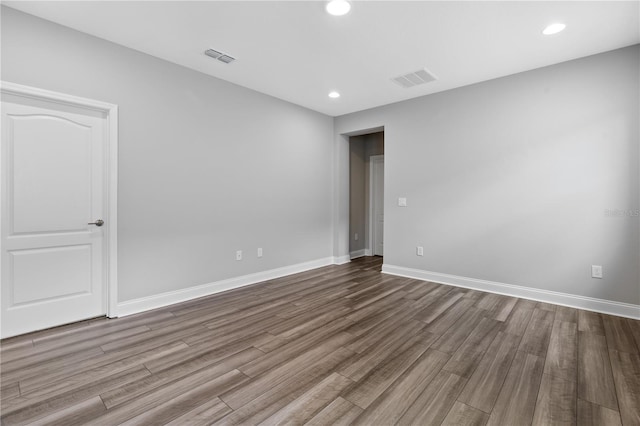 empty room with wood-type flooring