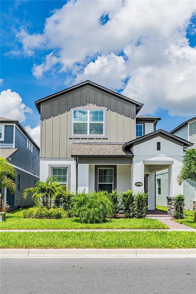 view of front of home with a front lawn