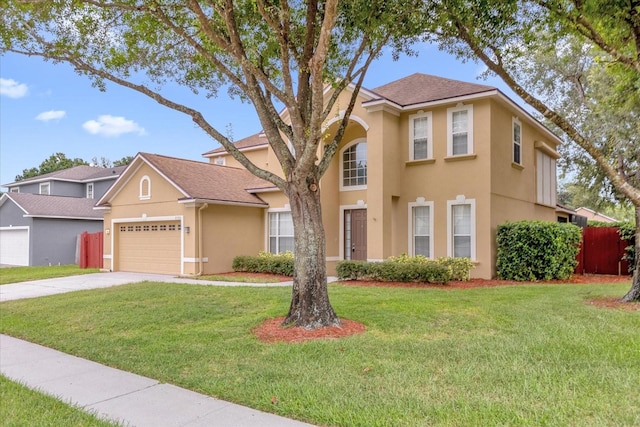 view of front of home with a garage and a front yard