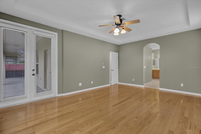 spare room featuring light wood-type flooring and ceiling fan