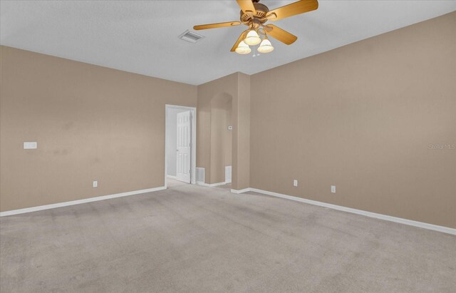 empty room featuring light carpet and ceiling fan