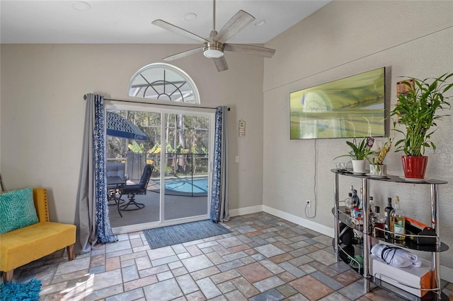 entryway featuring high vaulted ceiling and ceiling fan