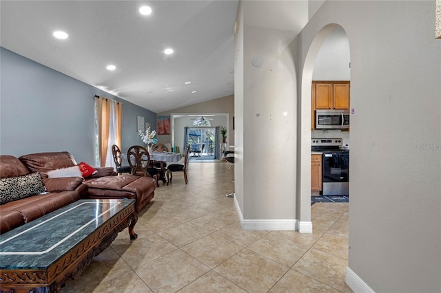 tiled living room with vaulted ceiling