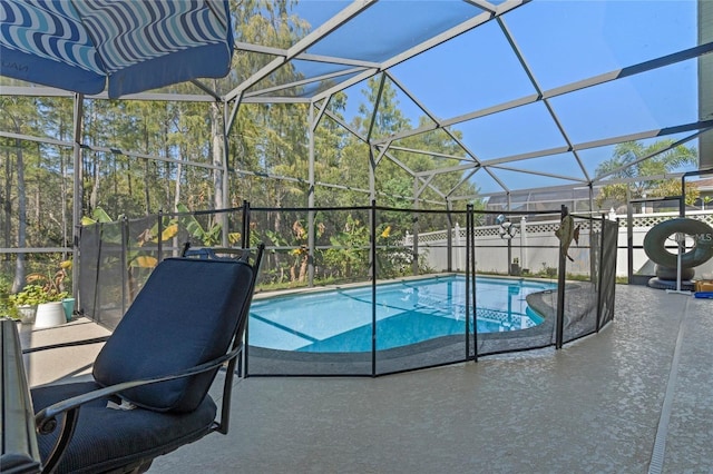 view of swimming pool featuring a patio, a lanai, and a fenced in pool