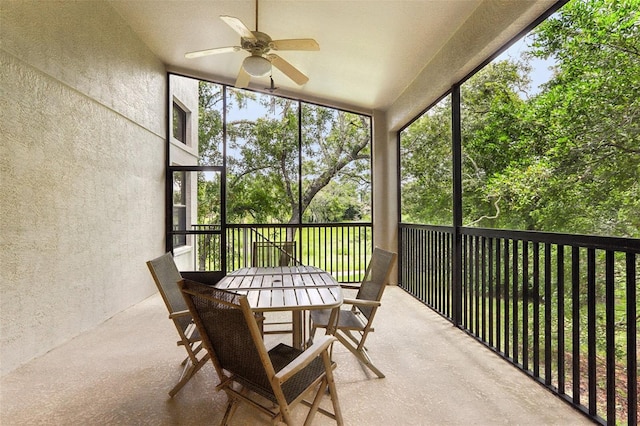 sunroom / solarium with ceiling fan