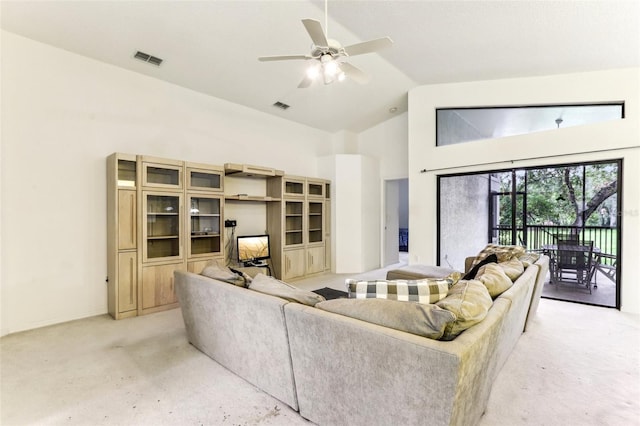 carpeted living room with lofted ceiling and ceiling fan