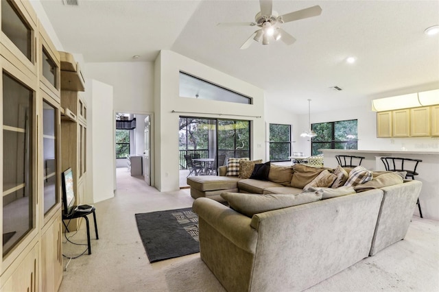 living room with lofted ceiling and ceiling fan