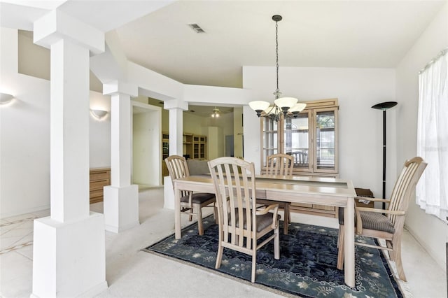 dining area featuring an inviting chandelier, vaulted ceiling, and ornate columns