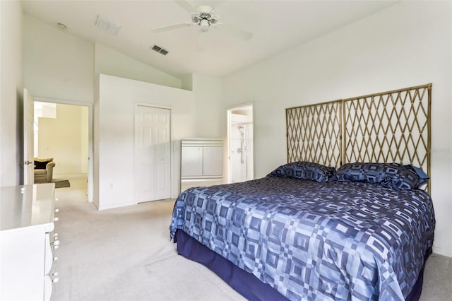 carpeted bedroom featuring ensuite bath, vaulted ceiling, and ceiling fan