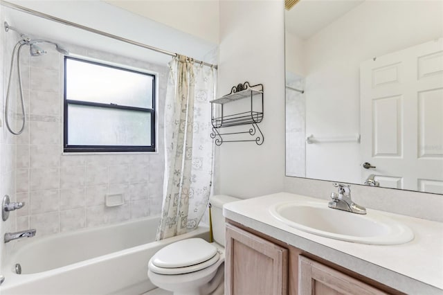 full bathroom featuring shower / bath combination with curtain, vanity, and toilet