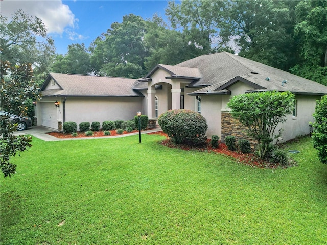 view of front of property with a garage and a front lawn