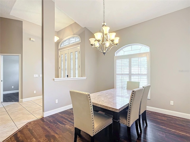 dining room with a chandelier and hardwood / wood-style floors