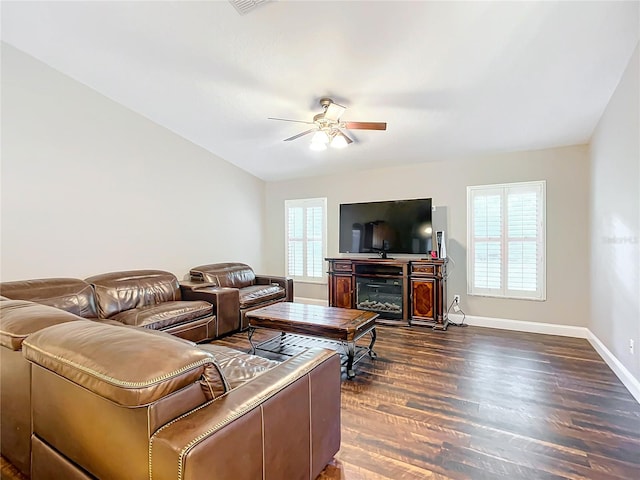 living room with lofted ceiling, ceiling fan, and dark hardwood / wood-style floors