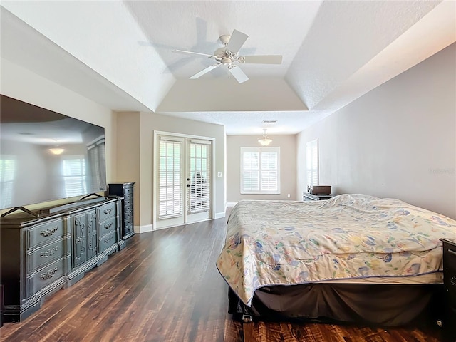 bedroom featuring french doors, dark wood-type flooring, access to outside, ceiling fan, and vaulted ceiling