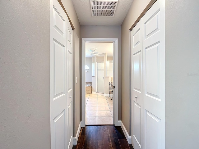 corridor featuring hardwood / wood-style flooring