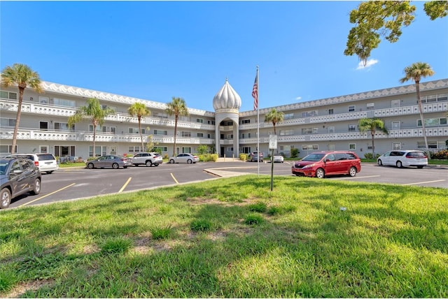 view of property with uncovered parking