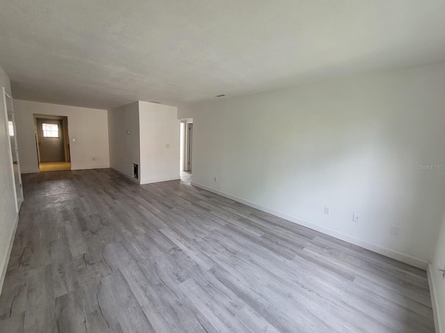 unfurnished room featuring wood-type flooring