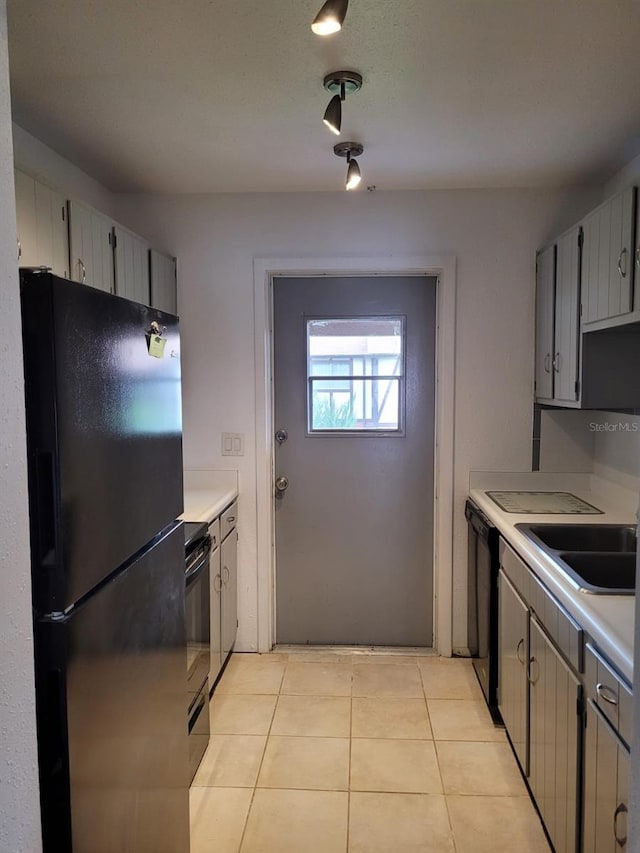 kitchen featuring black appliances and light tile patterned floors