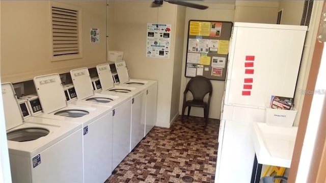 clothes washing area with washer and clothes dryer, ceiling fan, and tile patterned floors