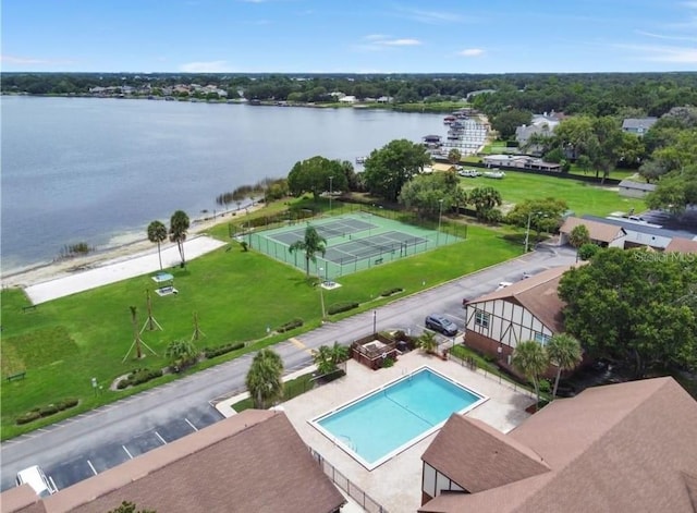 view of swimming pool with a water view