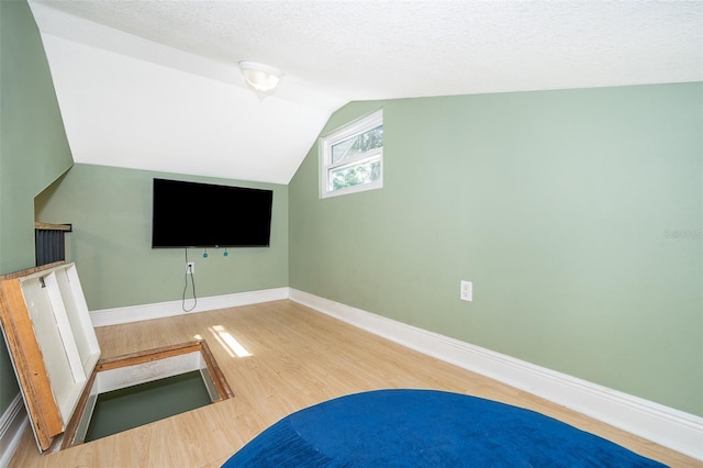 interior space with a textured ceiling and light wood-type flooring