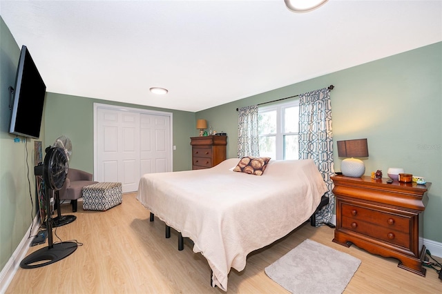 bedroom featuring a closet and light hardwood / wood-style floors