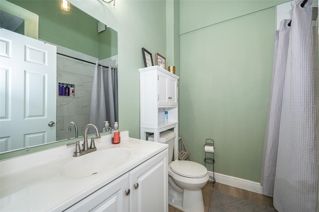 bathroom featuring hardwood / wood-style floors, vanity, and toilet