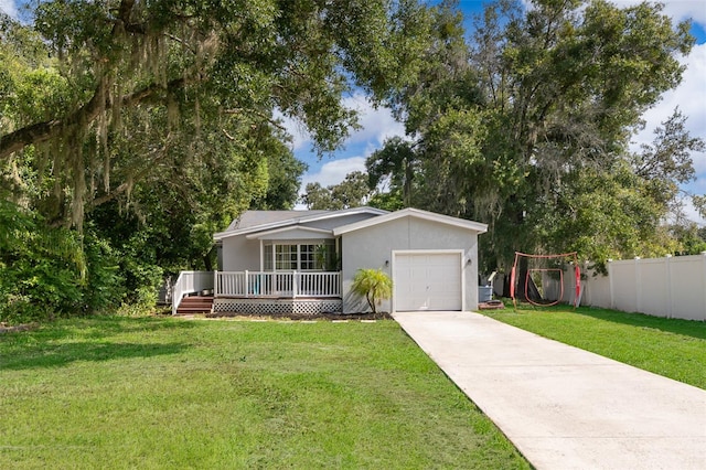 single story home with a garage and a front lawn