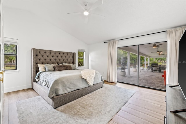 bedroom featuring light wood-type flooring, multiple windows, and access to outside