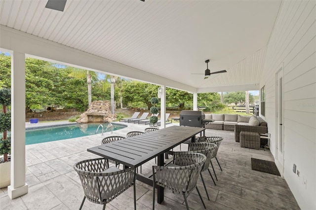 view of patio / terrace with an outdoor living space and ceiling fan