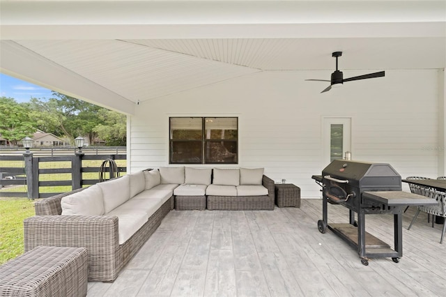 view of patio / terrace with an outdoor living space, grilling area, ceiling fan, and a deck