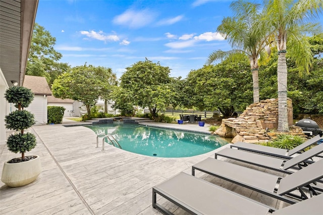 view of pool featuring a patio area