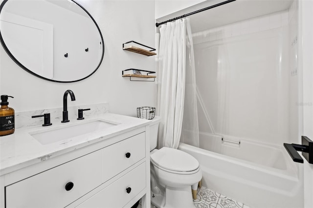 full bathroom with vanity, shower / tub combo, and toilet