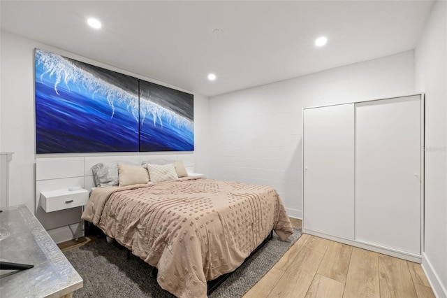 bedroom with light hardwood / wood-style flooring