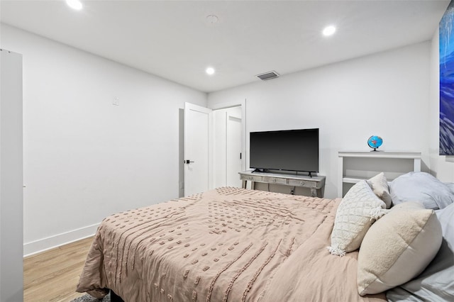 bedroom featuring light hardwood / wood-style floors